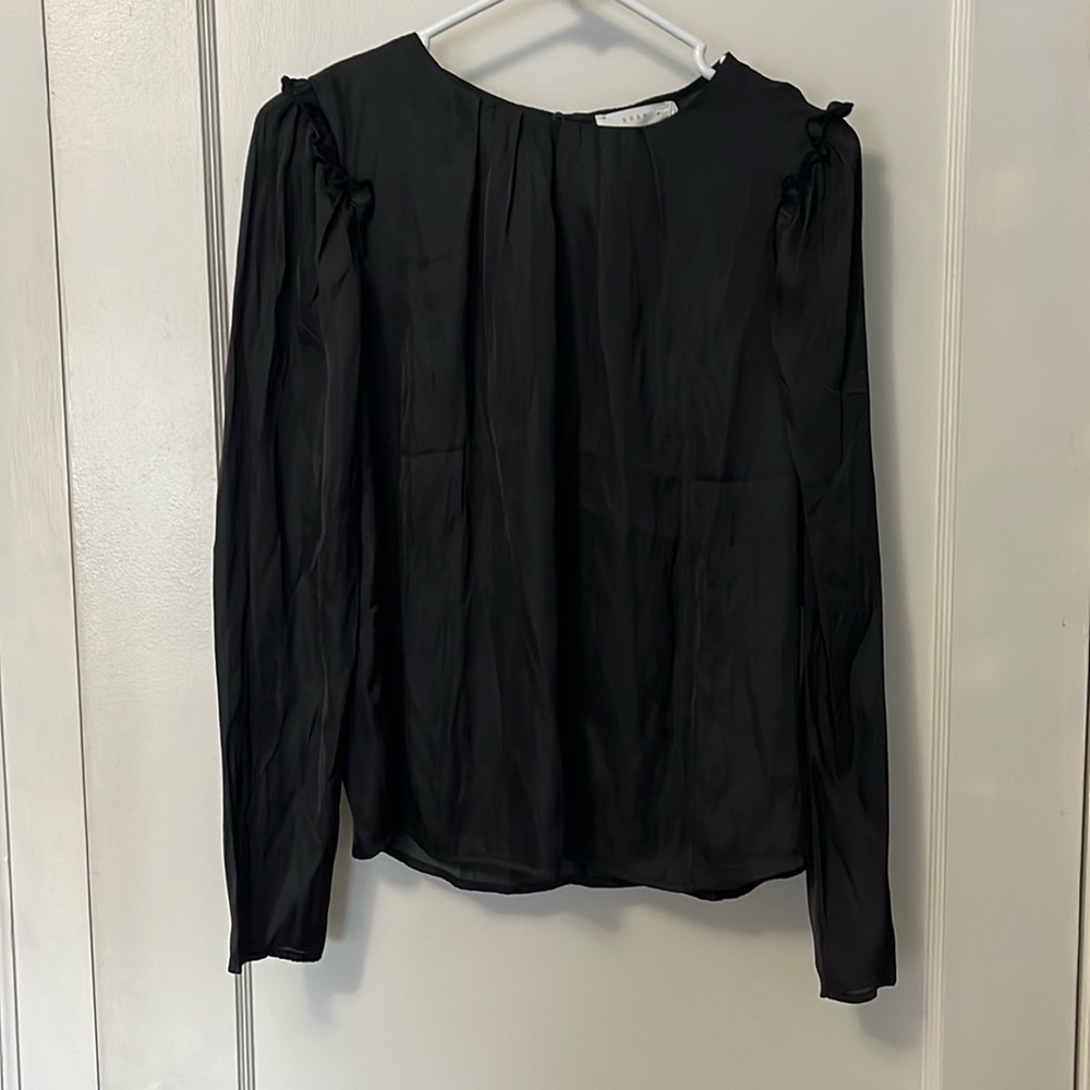 Lush long sleeve black shirt with ruffles on shoulders